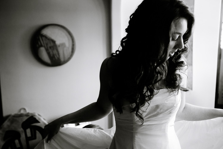 bride dressing before her Seacoast Science Center wedding