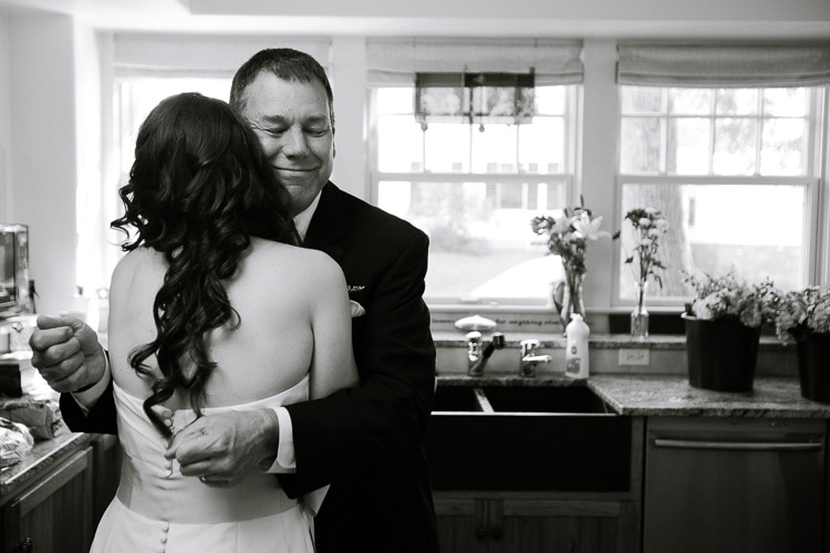 bride gets hug from dad before her Rye NH wedding