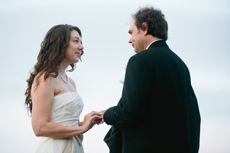 bride and groom exchange vows and rings at the Seacoast Science Center