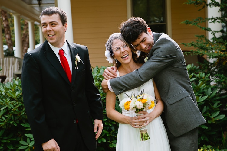 bride with siblings before backyard wedding in Walpole