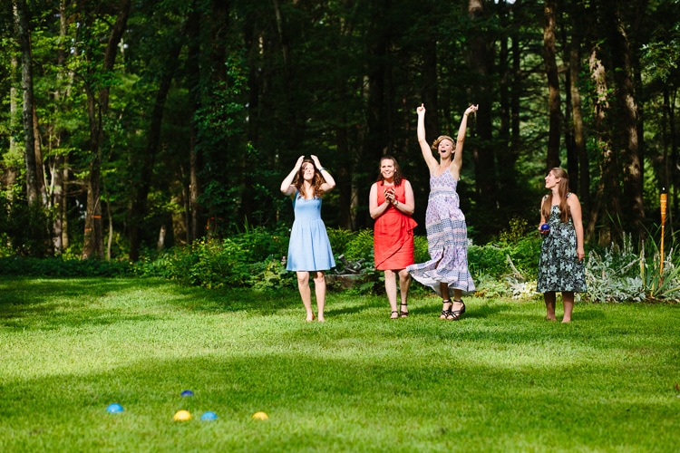 wedding guests play bocce