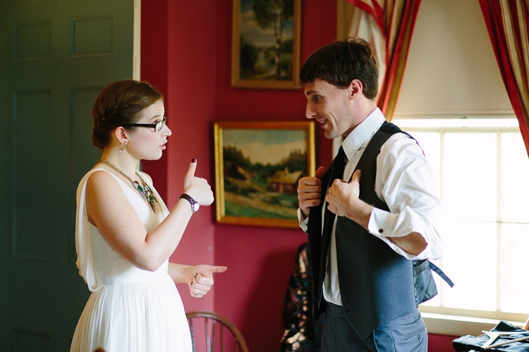 bride gives groom a thumbs up before their backyard Berkshires wedding ceremony