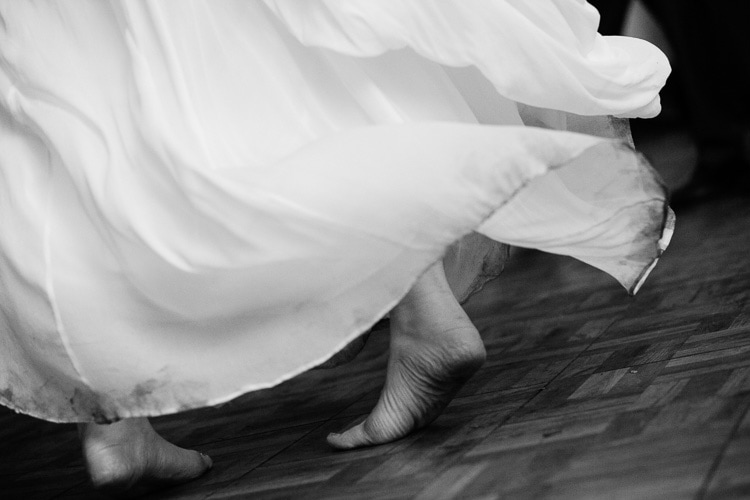 barefoot bride dancing at wedding reception