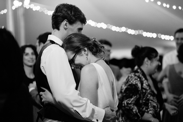 bride and groom share intimate moment during the last dance of their backyard Berkshires wedding reception