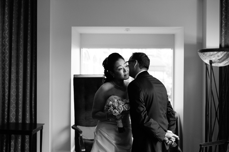 bride and groom see each other for the first time in the lobby of the hotel commonwealth