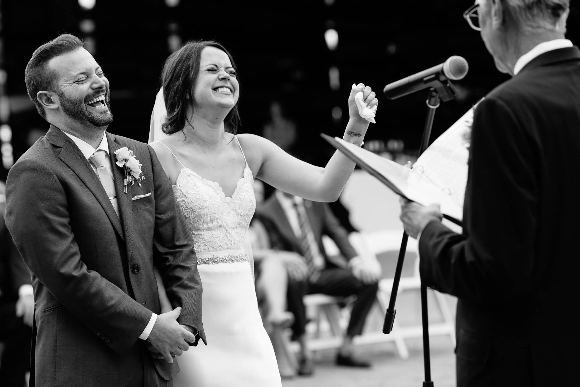 real wedding day photo of couple laughing during ceremony