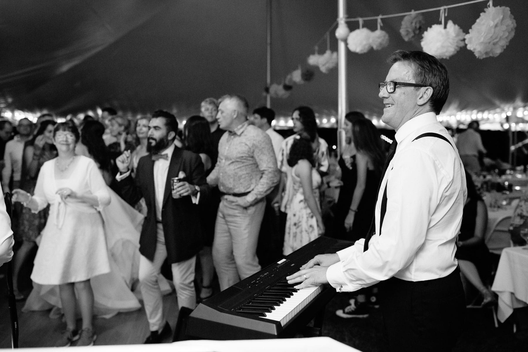 groom plays piano at his wedding reception in Northampton MA | Kelly Benvenuto Photography