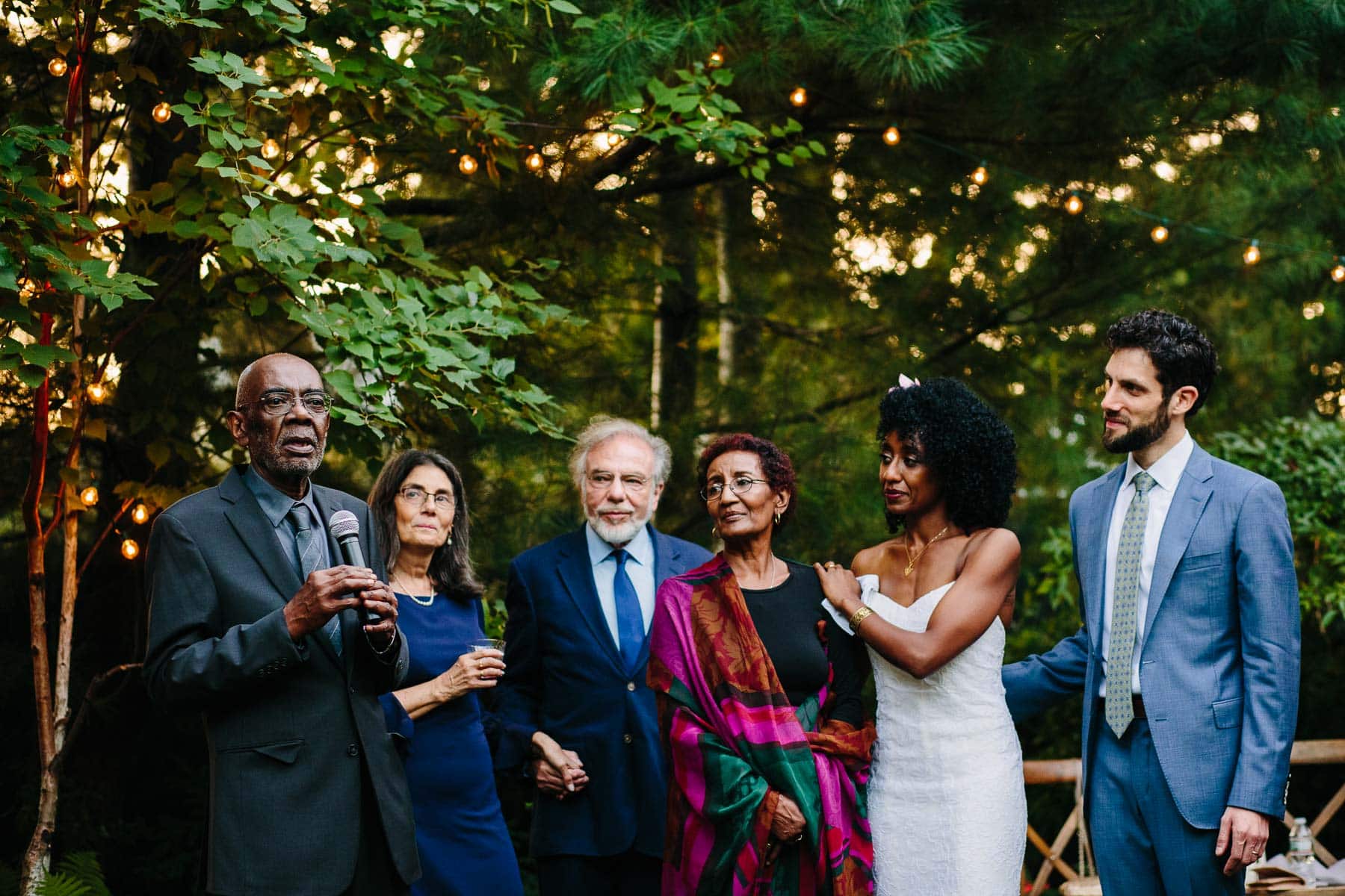 toasts in the backyard at a Cambridge wedding | Kelly Benvenuto Photography