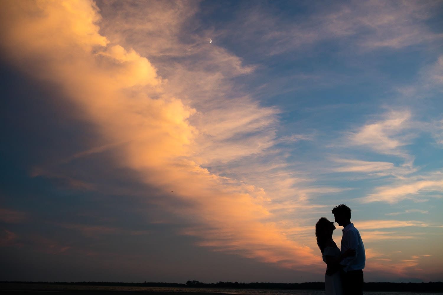 wedding portrait with dramatic summer sky