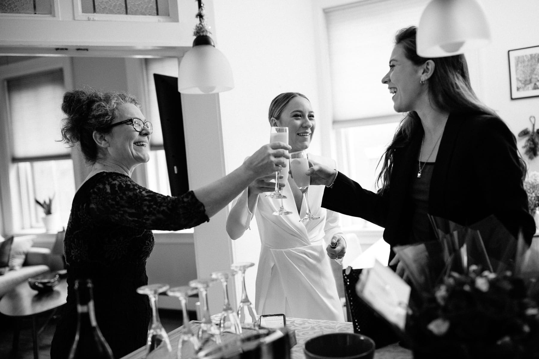 bride toasts with mimosas before city hall wedding