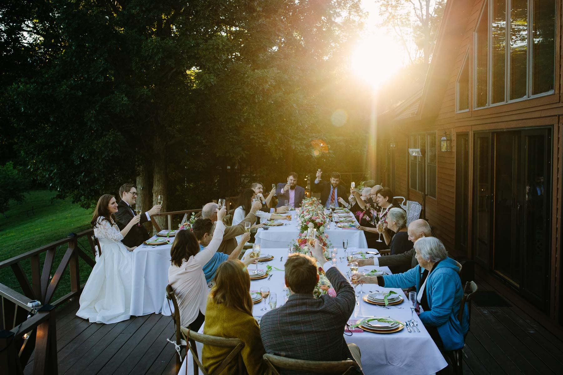 toasts during a backyard lake George wedding
