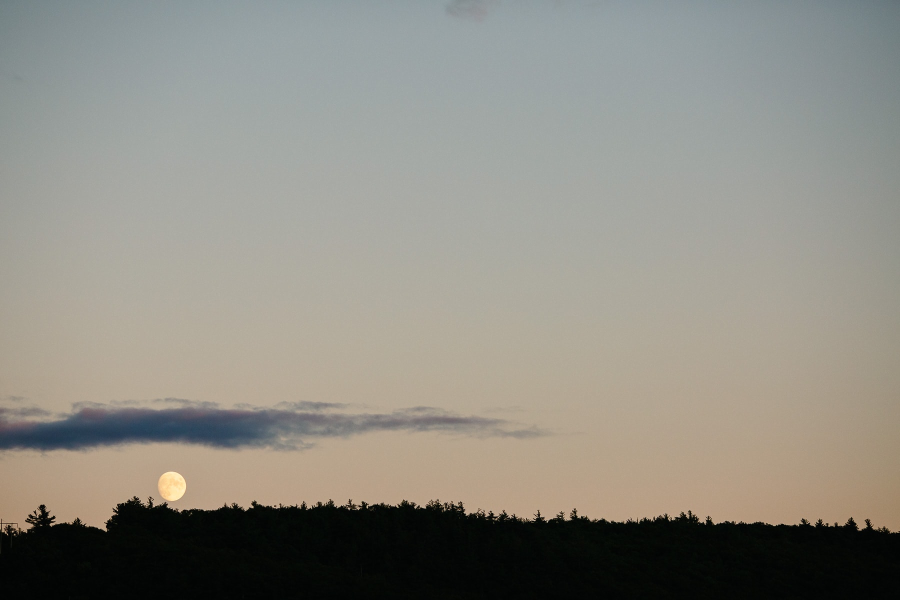 the moon rises over Lake George