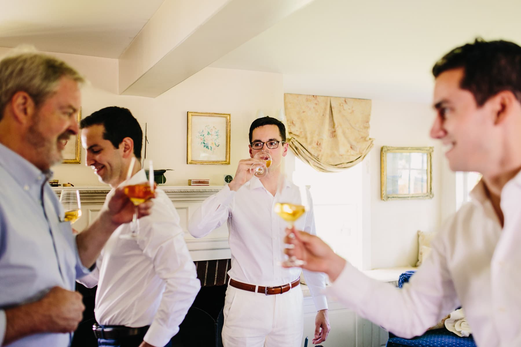 groom toasting with family