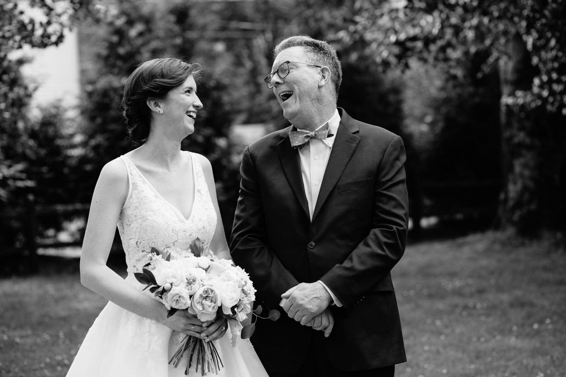 bride and father share a laugh