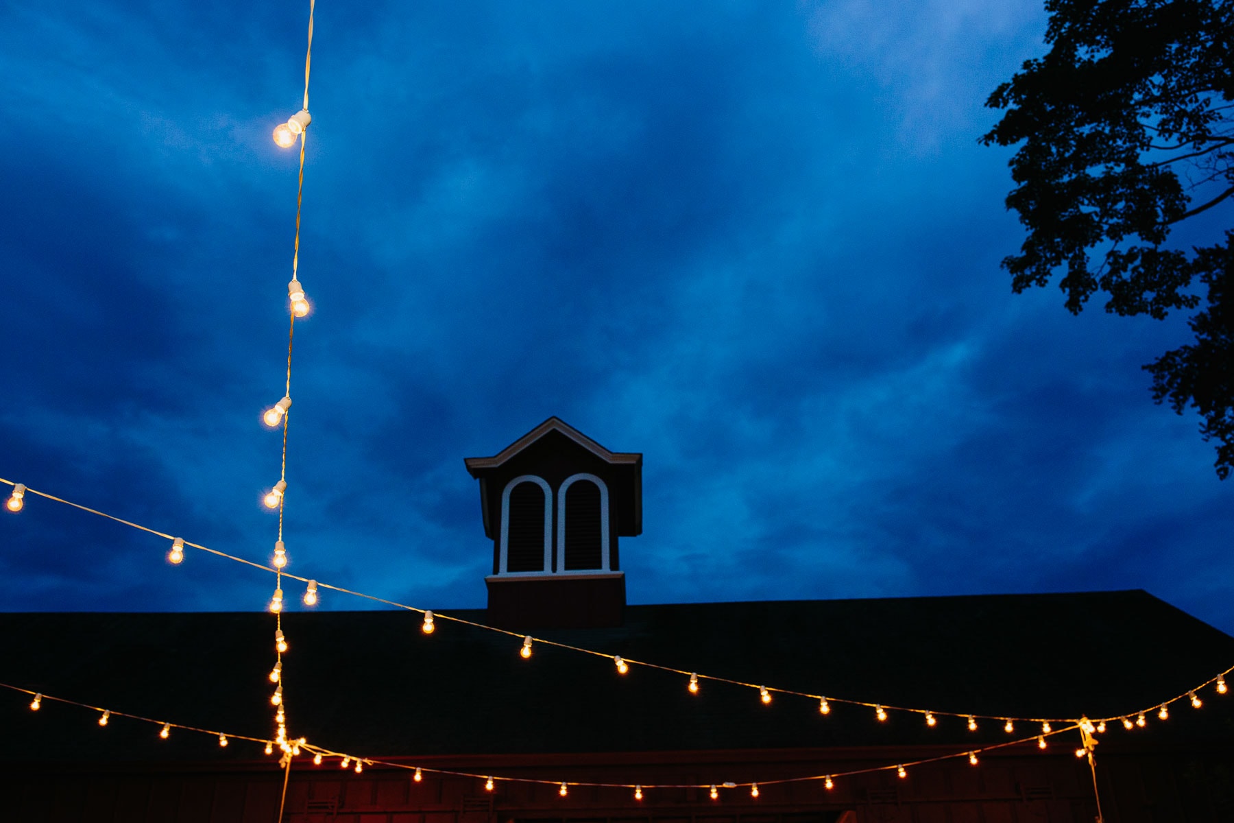 bistro lights and barn at blue hour