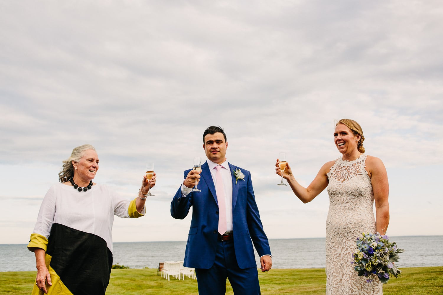bride and groom celebrate with a wedding toast