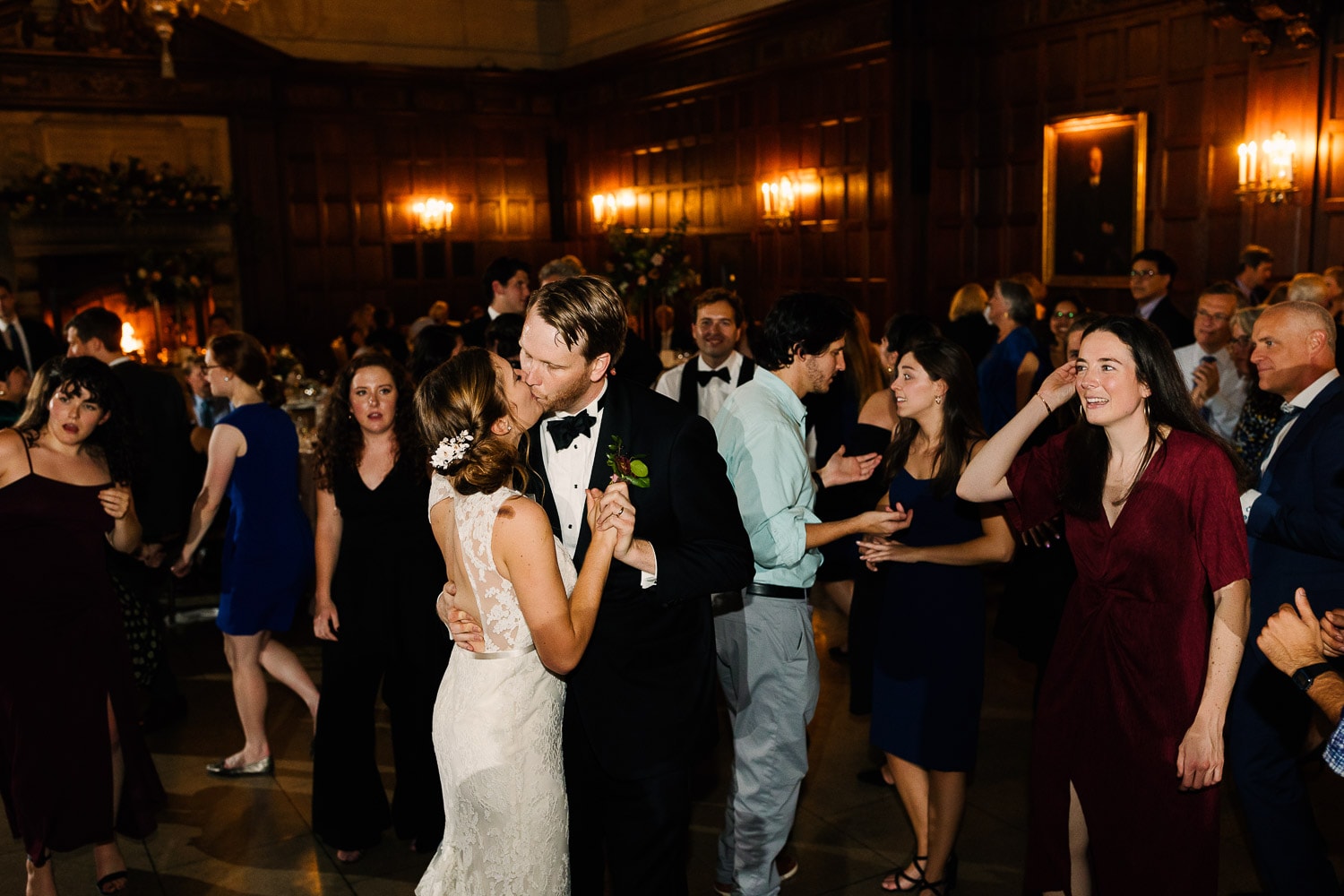 bride and groom share a kiss on the dance floor at their Harvard Club of Boston wedding cereption