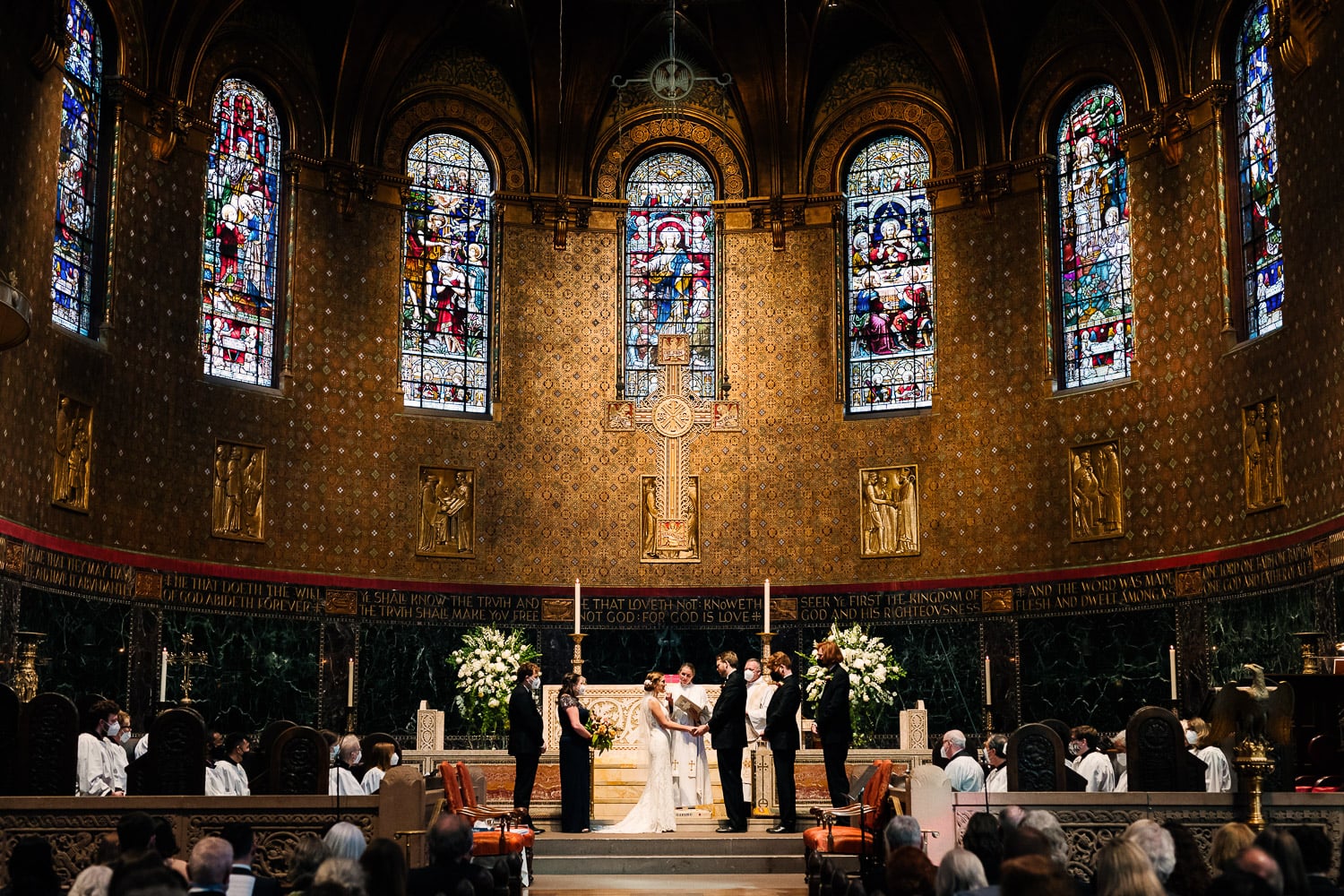 bride and groom on the altar of Trinity Church Boston