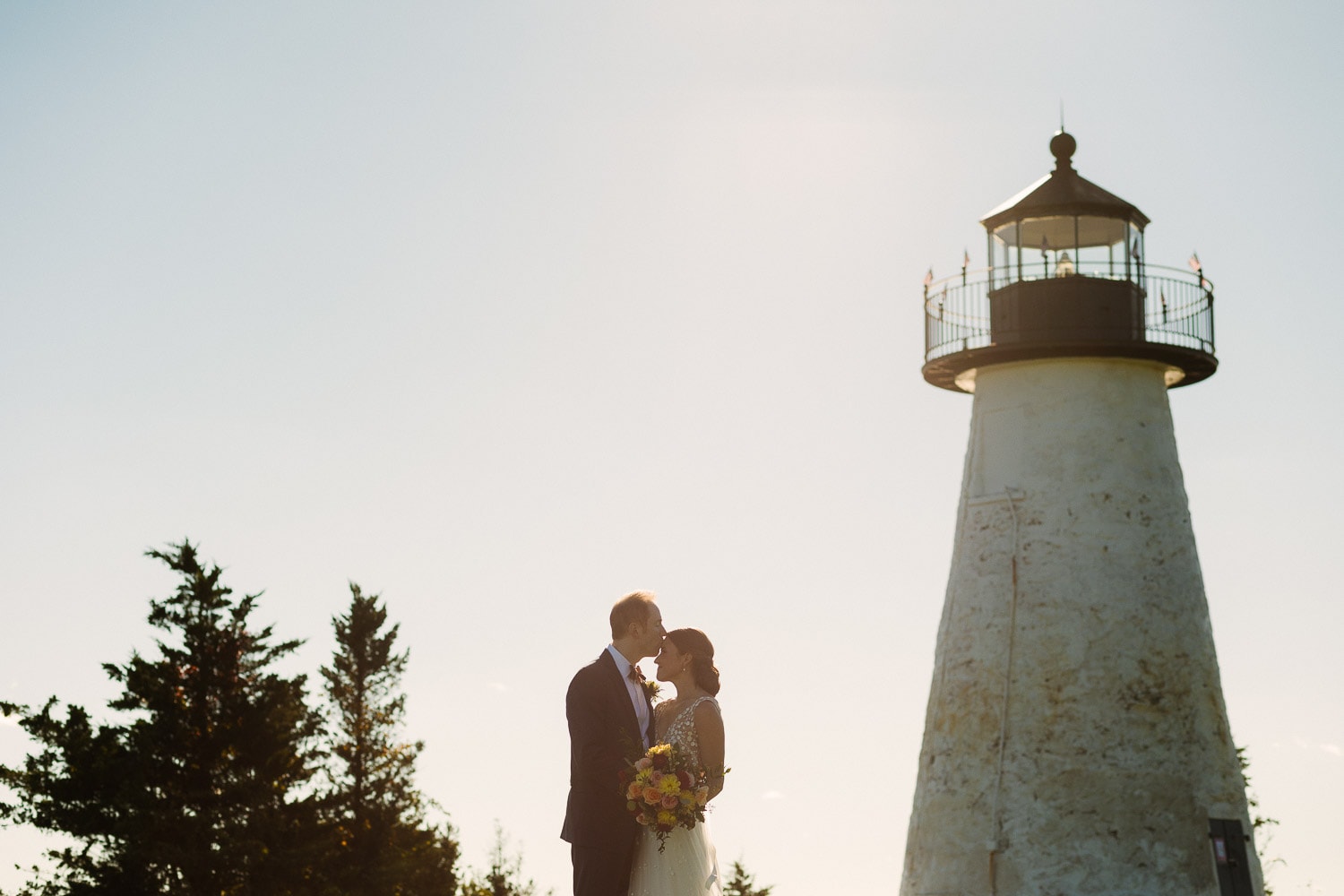 portrait of a bride and groom at Ned's Point Lighthouse in Mattapoisett, MA