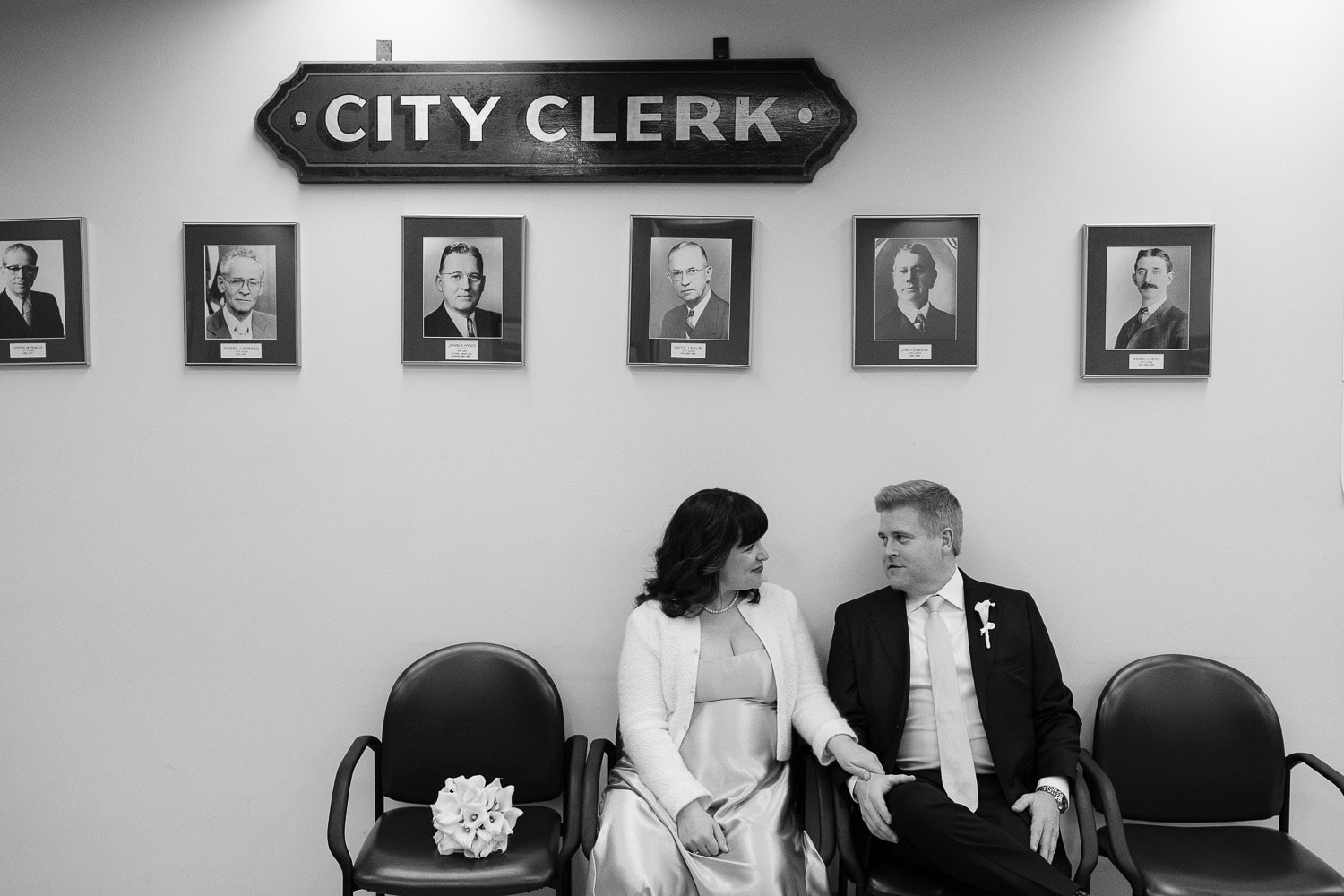 couple sitting in Boston city hall clerk's office